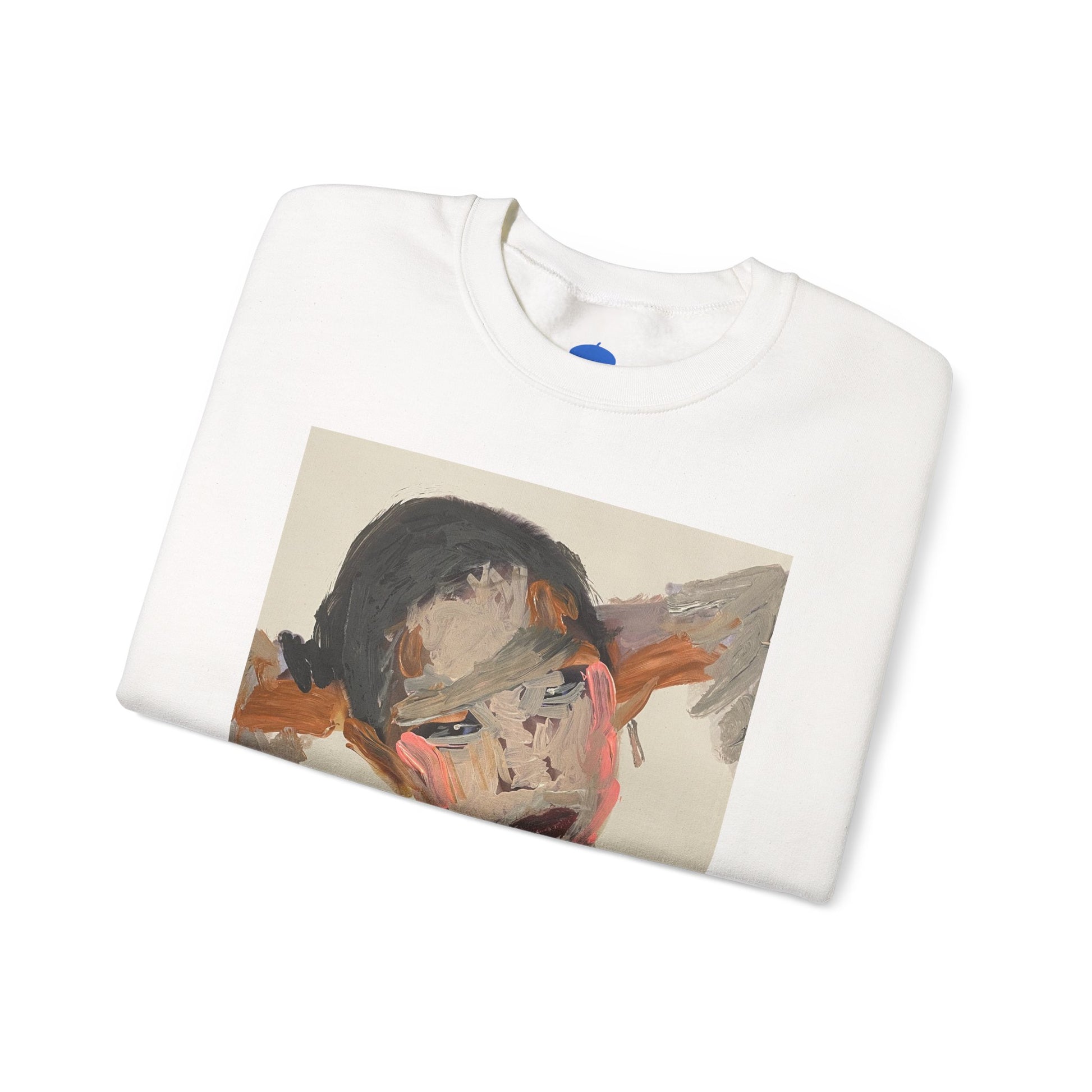 Folded white sweatshirt with a graphic design on a white background