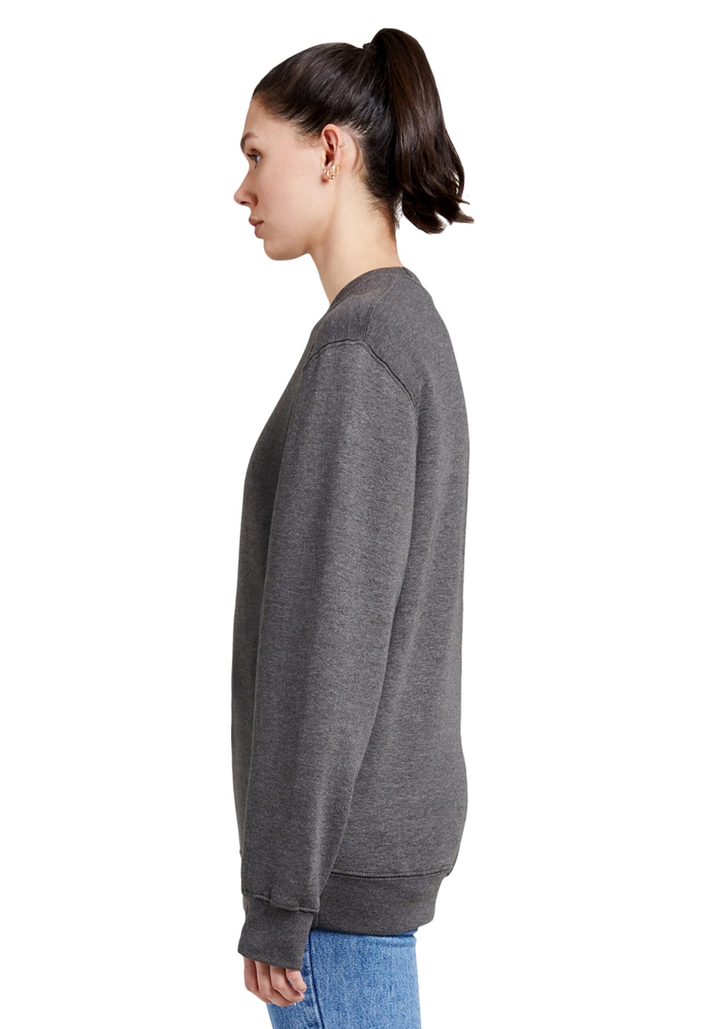 Side view of a woman wearing a grey charcoal sweatshirt featuring a striking painting-style paintover graphic of a man or woman wearing a coat with red nails and red lips. This piece blends the world of art and fashion, standing out among trendy attires you only discover in artist studios.