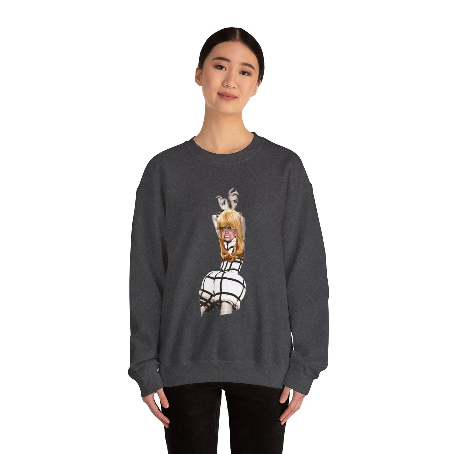 Woman wearing a dark grey charcoal sweatshirt with a graphic design of a blond woman on a white background